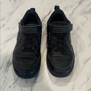 Boys black low top Nikes